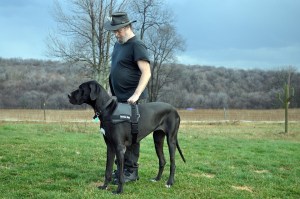 Man with a service dog [public domain image]